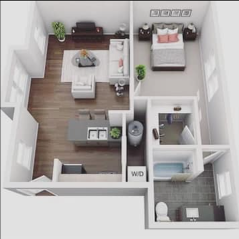 a bedroom with a bed and a couch in a room